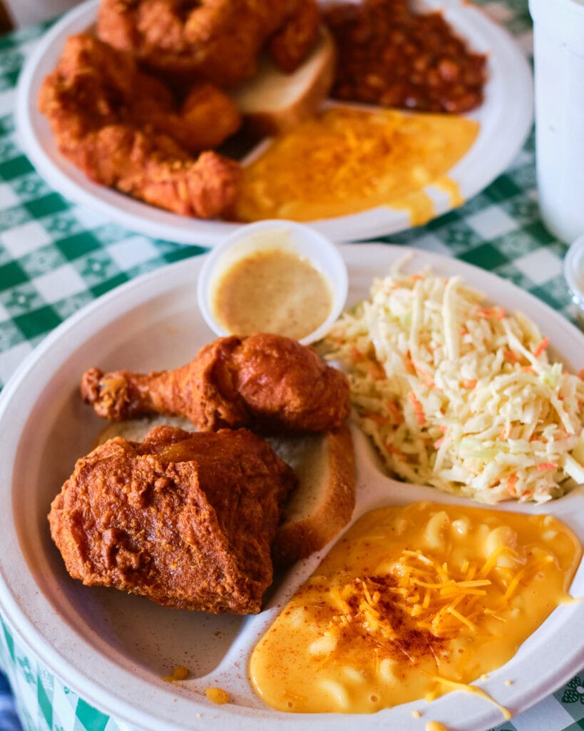 fried chicken on plate with macaroni and cole slaw
