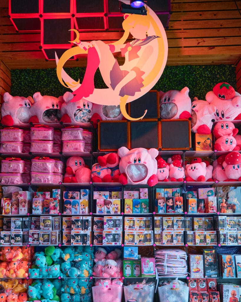 merchandise shop with Kirby, Pokemon, and Sailor Moon goods.