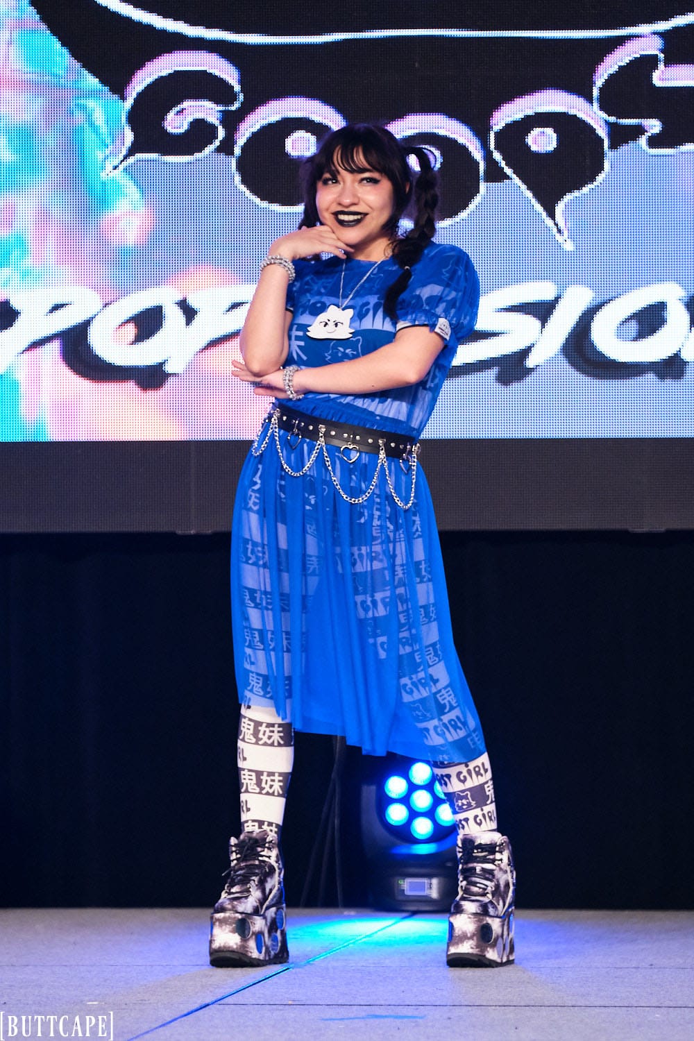 model wearing blue mesh dress smiling and posing full body 2.