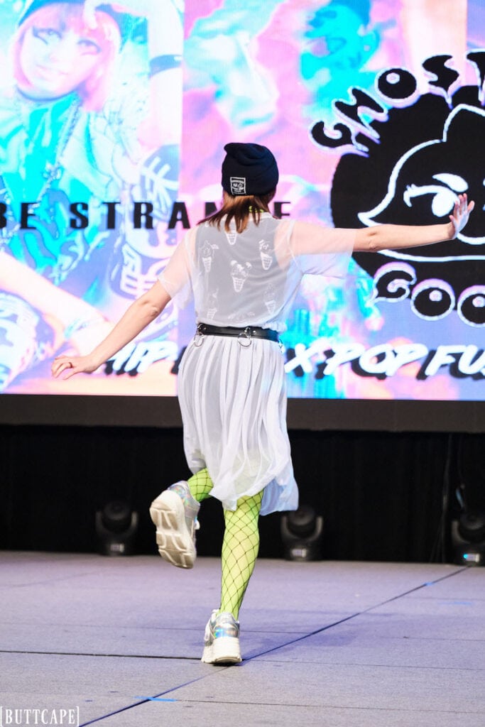 ghost girl goods designer posing on stage backside.