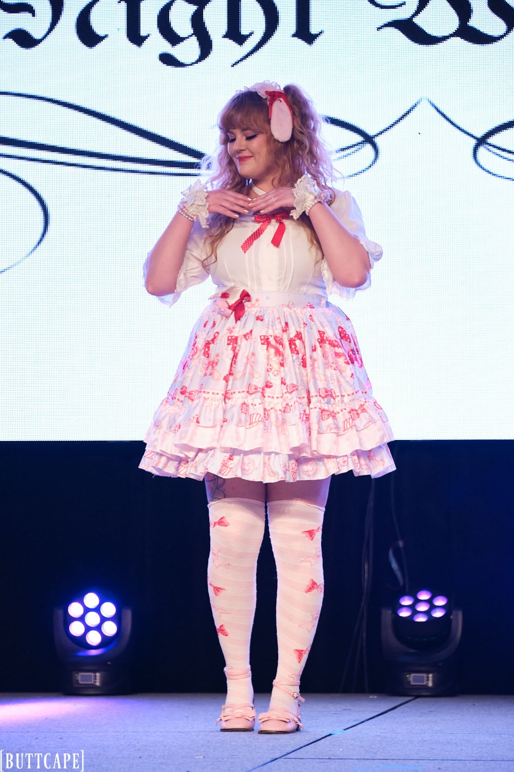 sweet lolita model wearing white blouse and pink skirt.