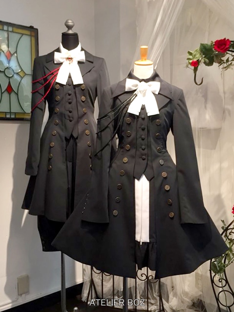 two mannequins dressed in Roland Jacket outfits, one in masculine style and one in feminine style.