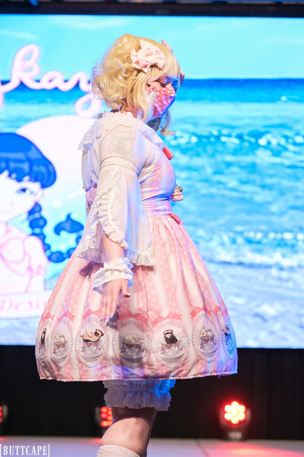 Kittykaya model 4 wearing pink lolita dress with tea cup theme and polka dot fabric - closeup 2.