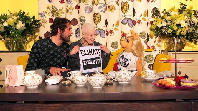 Vivienne Westwood sitting next to Miss Piggy talking about climate change.