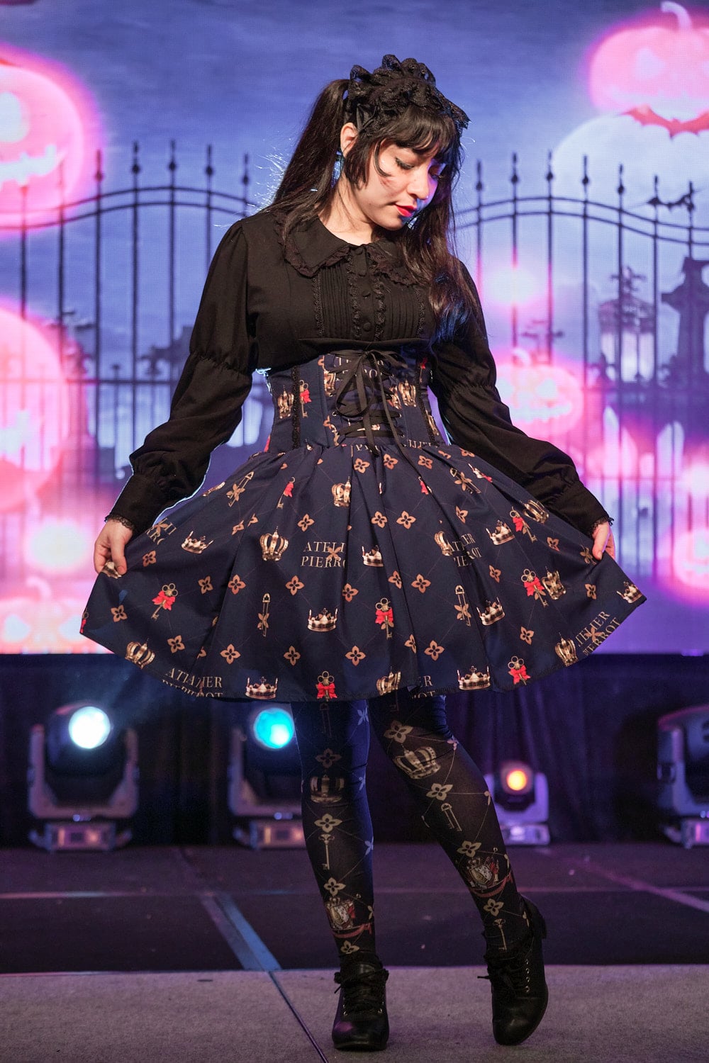 Classic lolita model wearing black cotton cutsew and navy high waist skirt with key print with matching tights - full body 1.