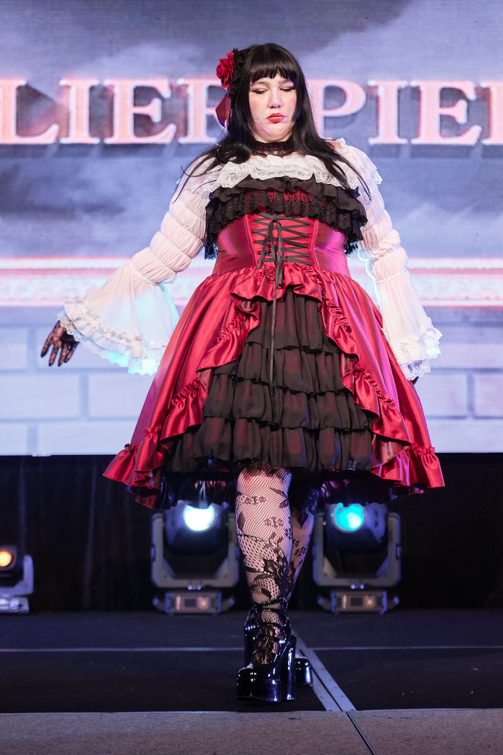 Plus size gothic lolita wearing red and black shantung bustle dress with white princess sleeve blouse, lace tights, and black shoes - full body 5.