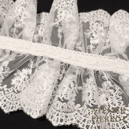 Closeup of original white lace by Atelier Pierrot.