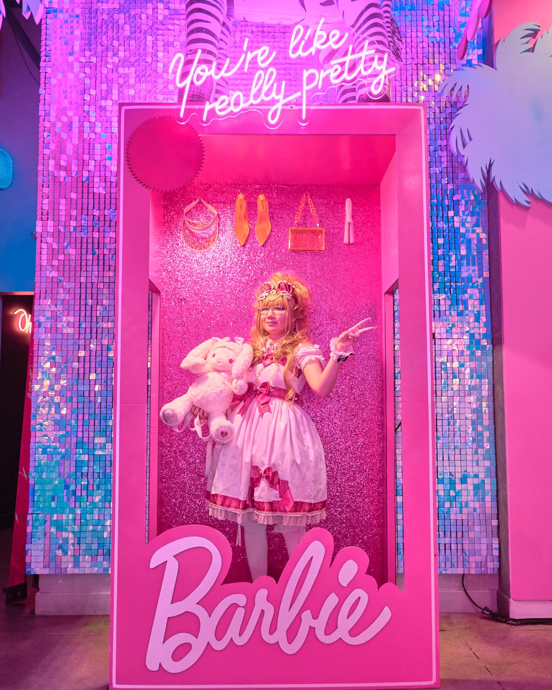 Blogger standing inside Barbie doll box.