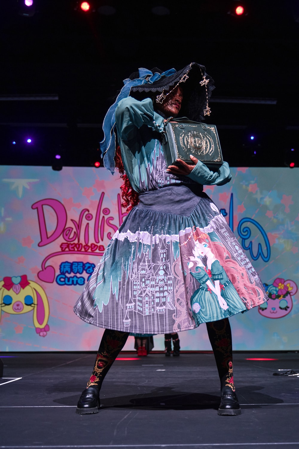 Classic lolita model wearing printed blouse and skirt with magic, castle and princesses theme - full body pose 1.