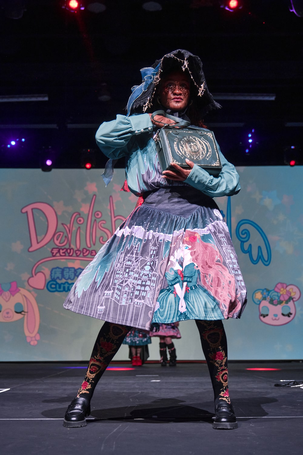Classic lolita model wearing printed blouse and skirt with magic, castle and princesses theme - full body pose 2.