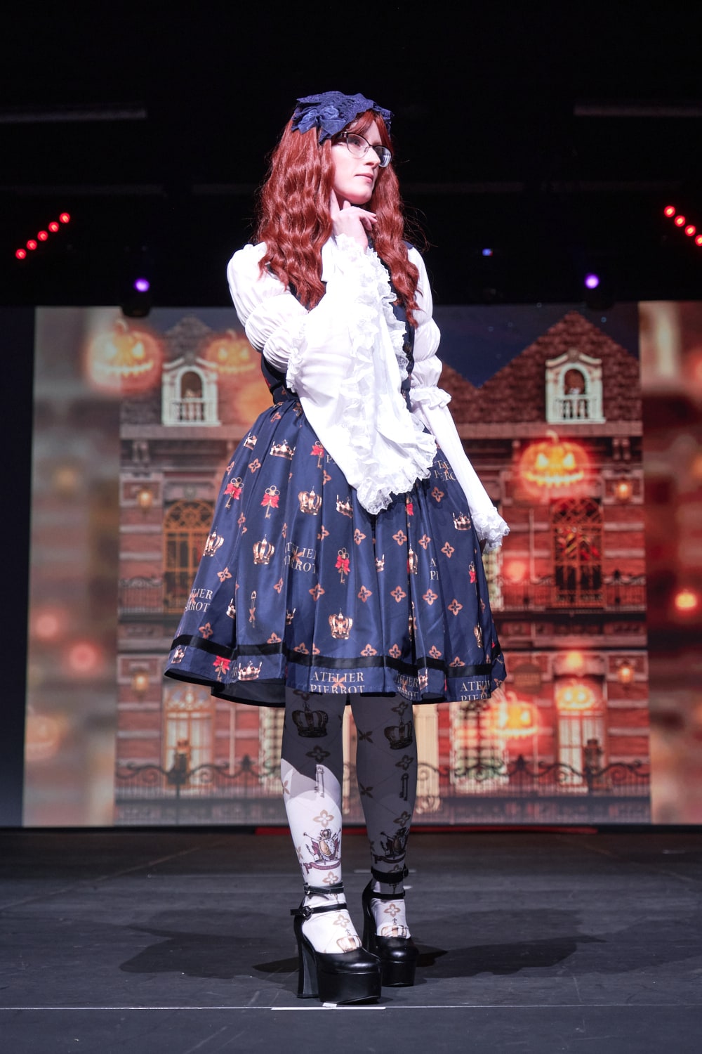 Atelier Pierrot classic lolita model wearing white princess sleeve blouse with crown print vest-style jumperskirt and matching crown tights - full body standing pose 3.