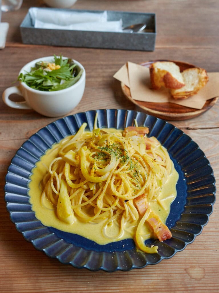 kabocha, onion, and bacon cream pasta with small side salad and bread