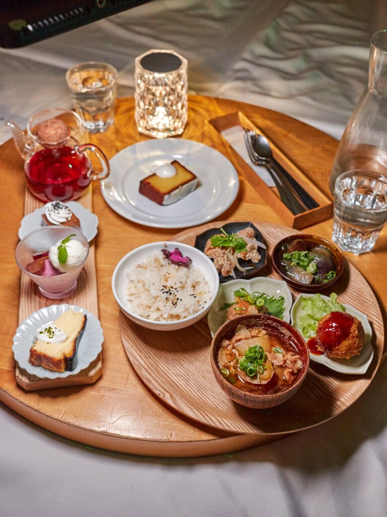 Table on cushioned floor serving 3 dessert set, setouchi lemon pound cake, and small plates dinner set