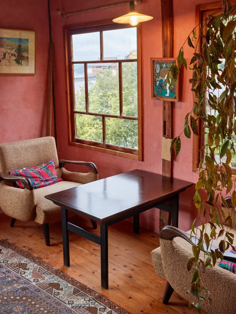 Two person cafe table seating against a window in an old Japanese house