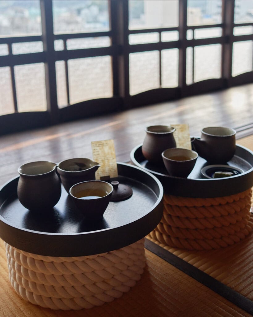 Tea house tea set with a view of old Japanese windows in the back
