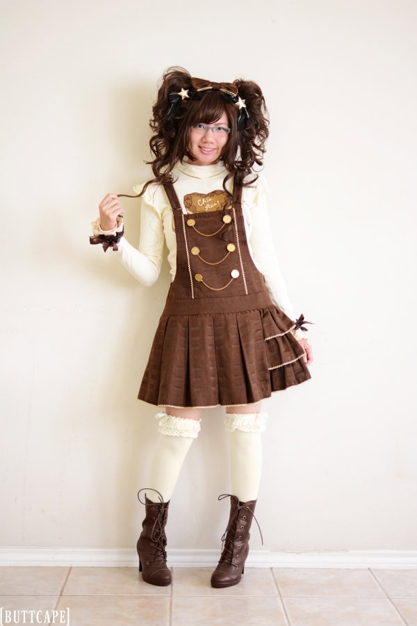 Chocolate themed sweet lolita coordinate with cream and brown tones. This outfit features a cream turtleneck and chocolate jacquard salopette by Angelic Pretty.