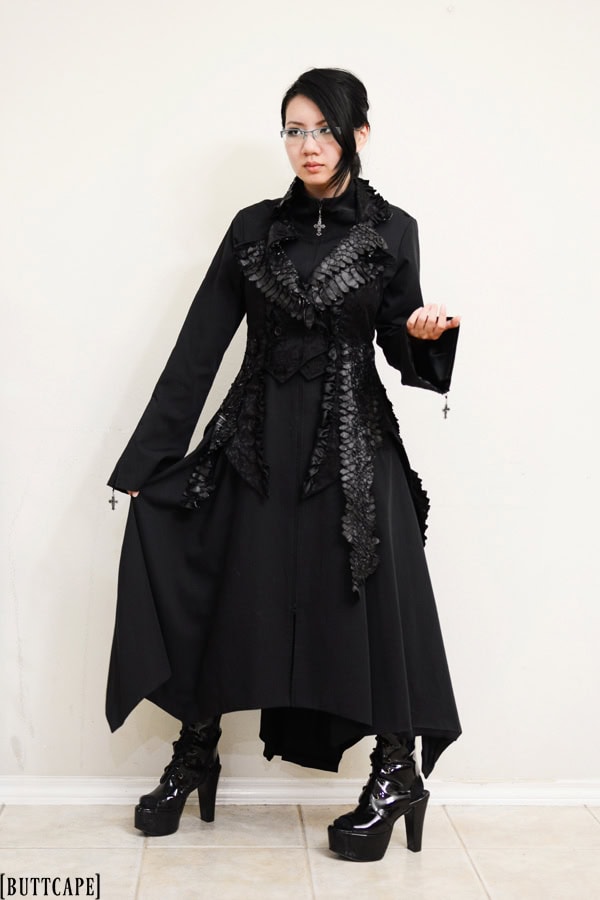 Minimalist gothic outfit with priest inspired dress and enamel platform shoes.