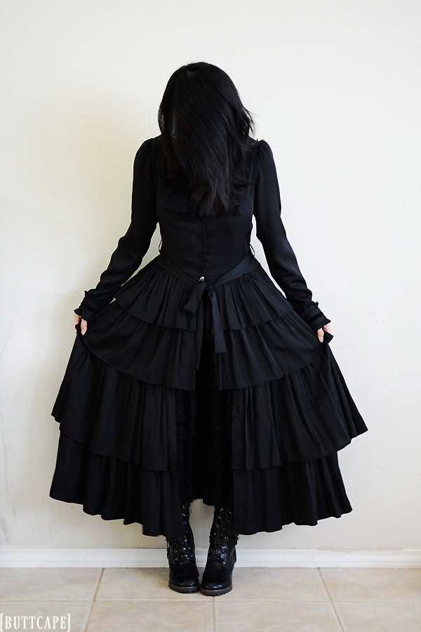 Gothic outfit with long voluminous blouse dress that reaches ankles.