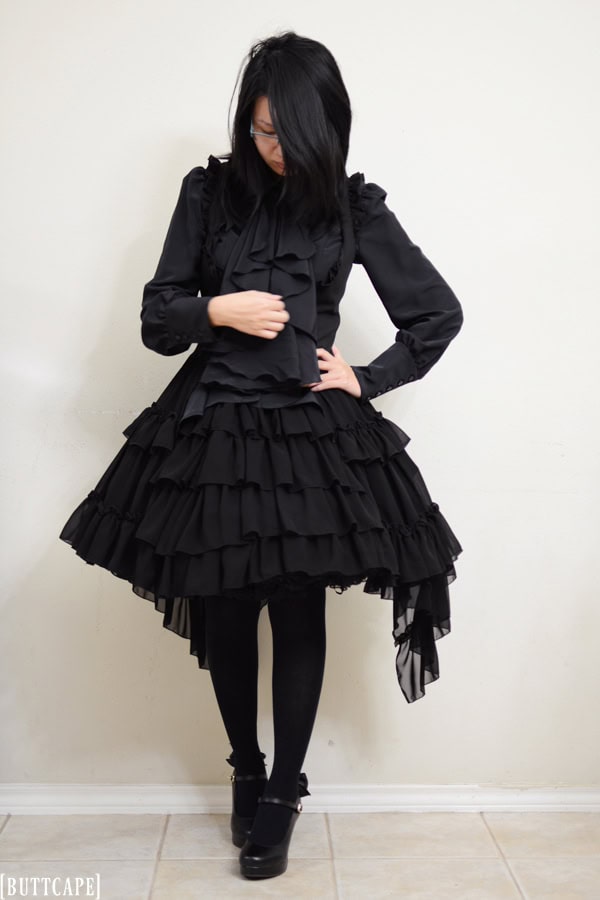 Gothic lolita outfit jabot blouse and tiered asymmetrical skirt.