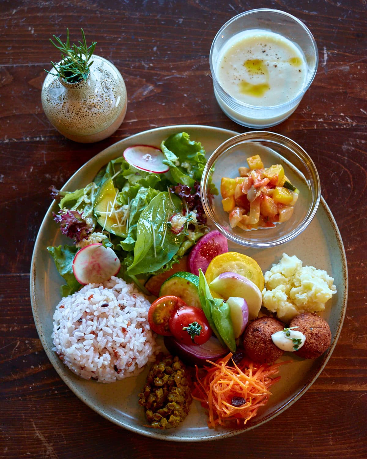 Veg Out Plate featuring seasonal local vegetables, rice, and corn soup
