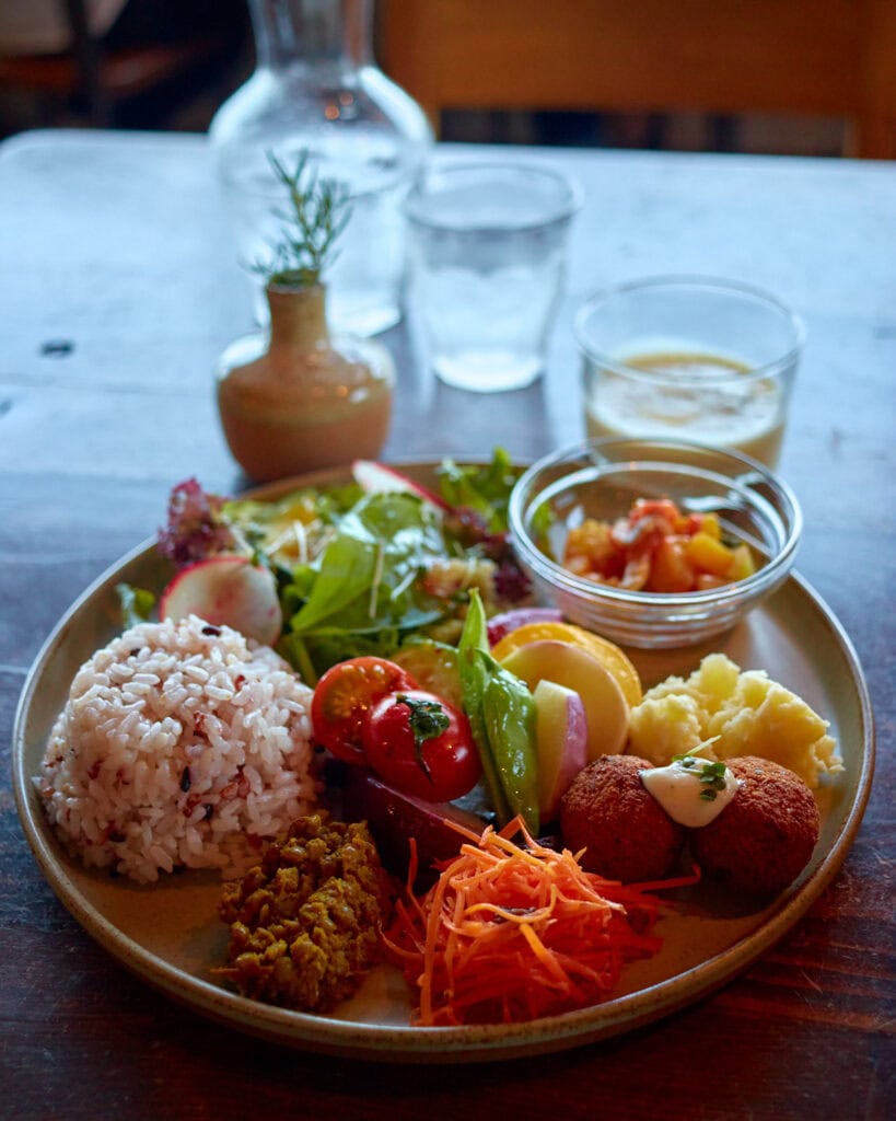 Veg Out Plate with rice, local seasonal vegetables, and corn soup