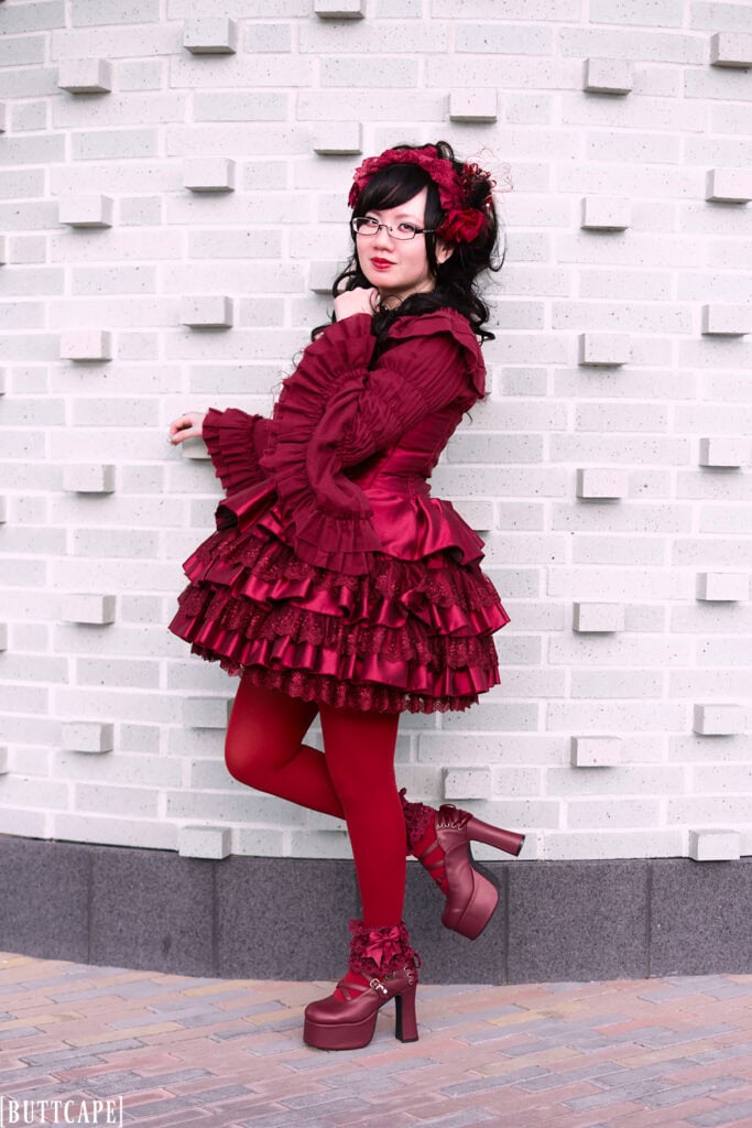 Full body shot of outfit standing in front of brick wall - 1.