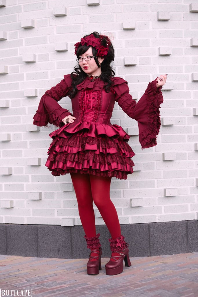 Full body shot of outfit standing in front of brick wall - 2.
