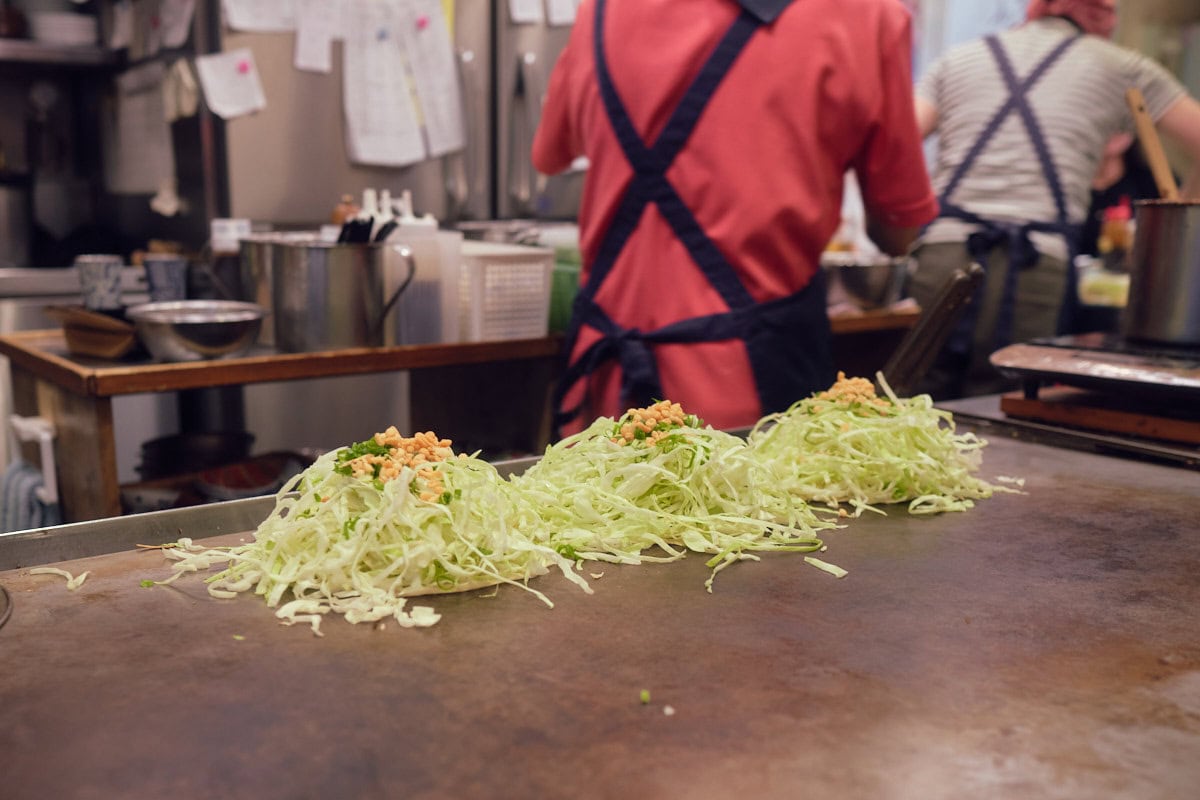hiroshima style okonomiyaki being made