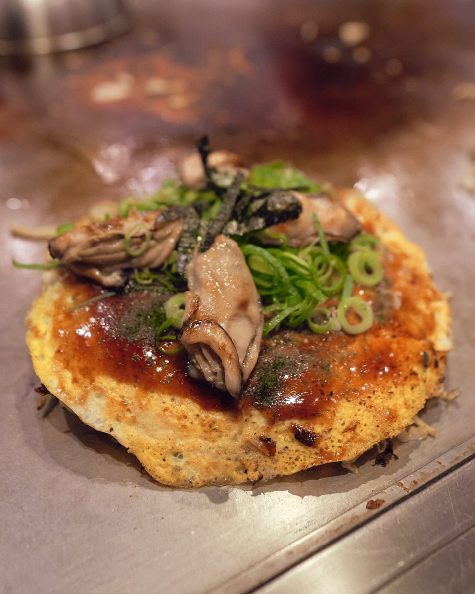 hiroshima style okonomiyaki topped with 4 local oysters