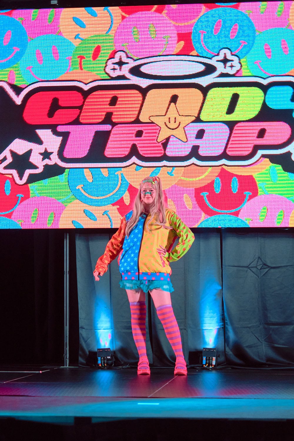 Candy Trap model #9 wears color blocking parka and skirt featuring polka dots.