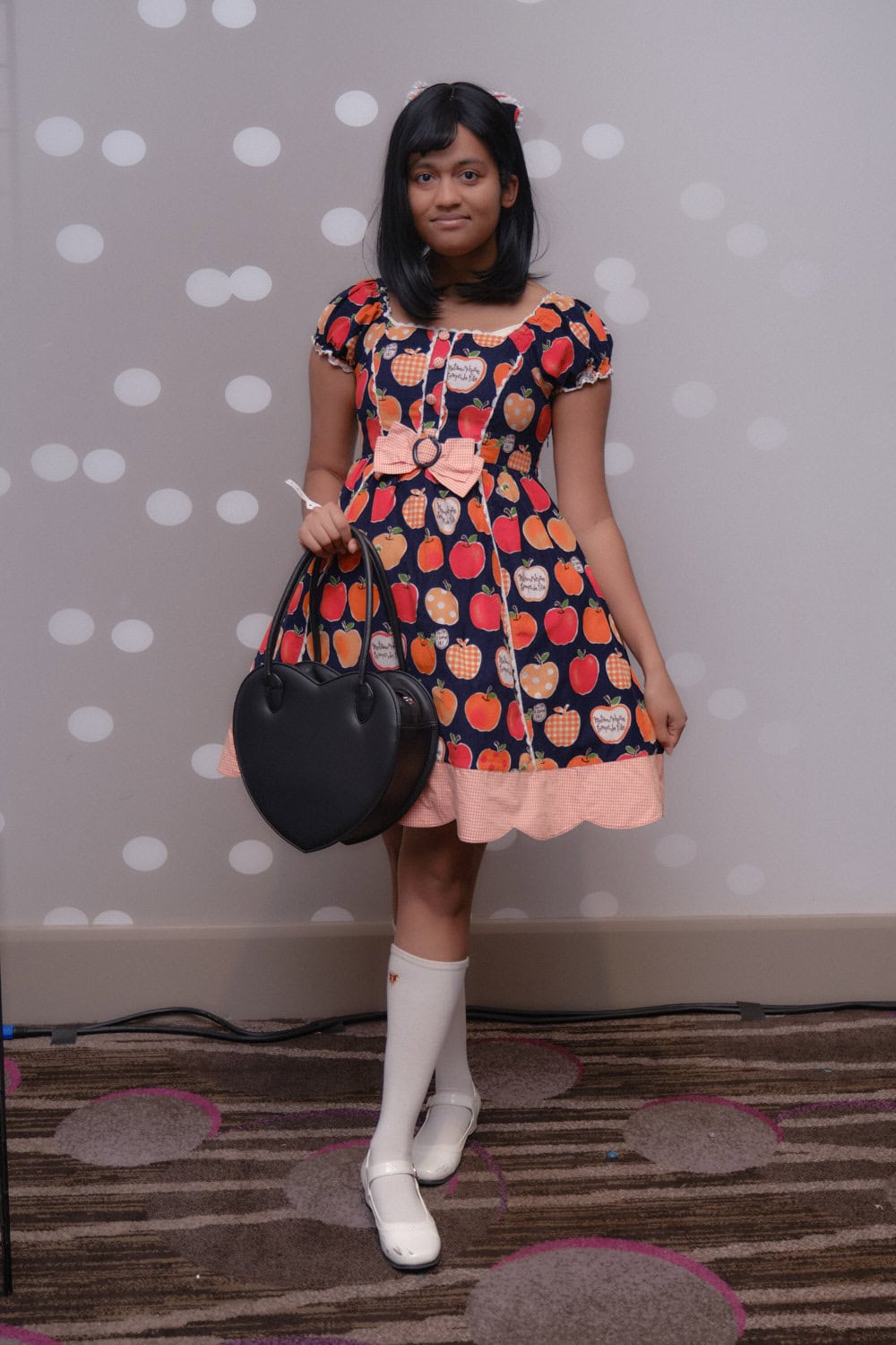Sweet lolita wearing apple print dress.