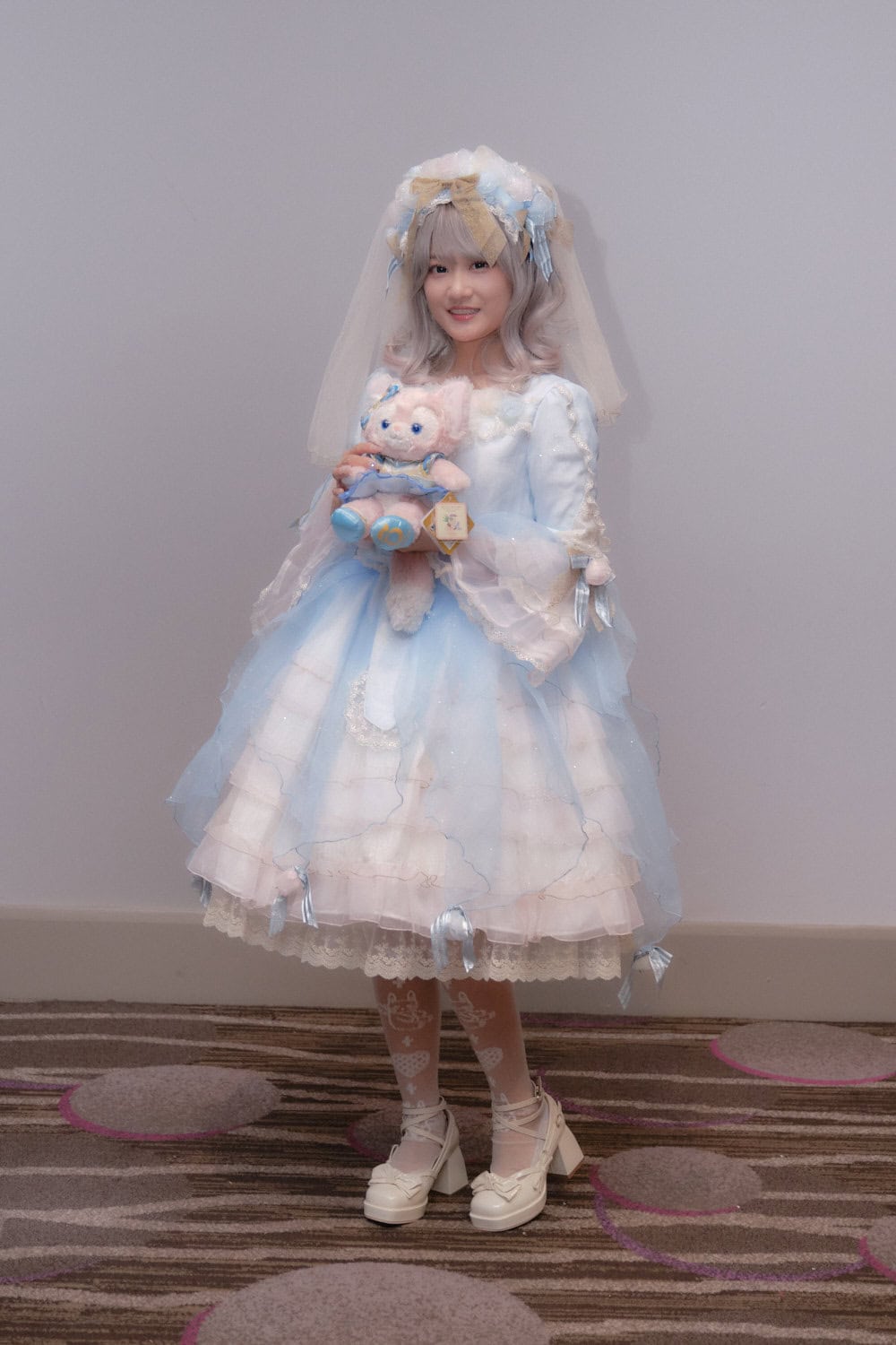 Sweet lolita wearing sax and wihte outfit with veil and tulle.