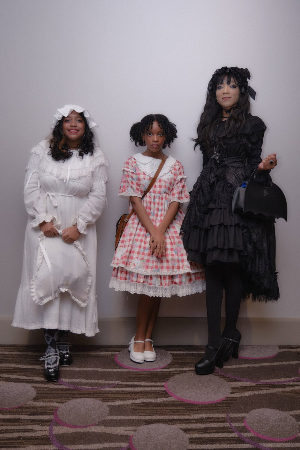 Three lolitas standing together.