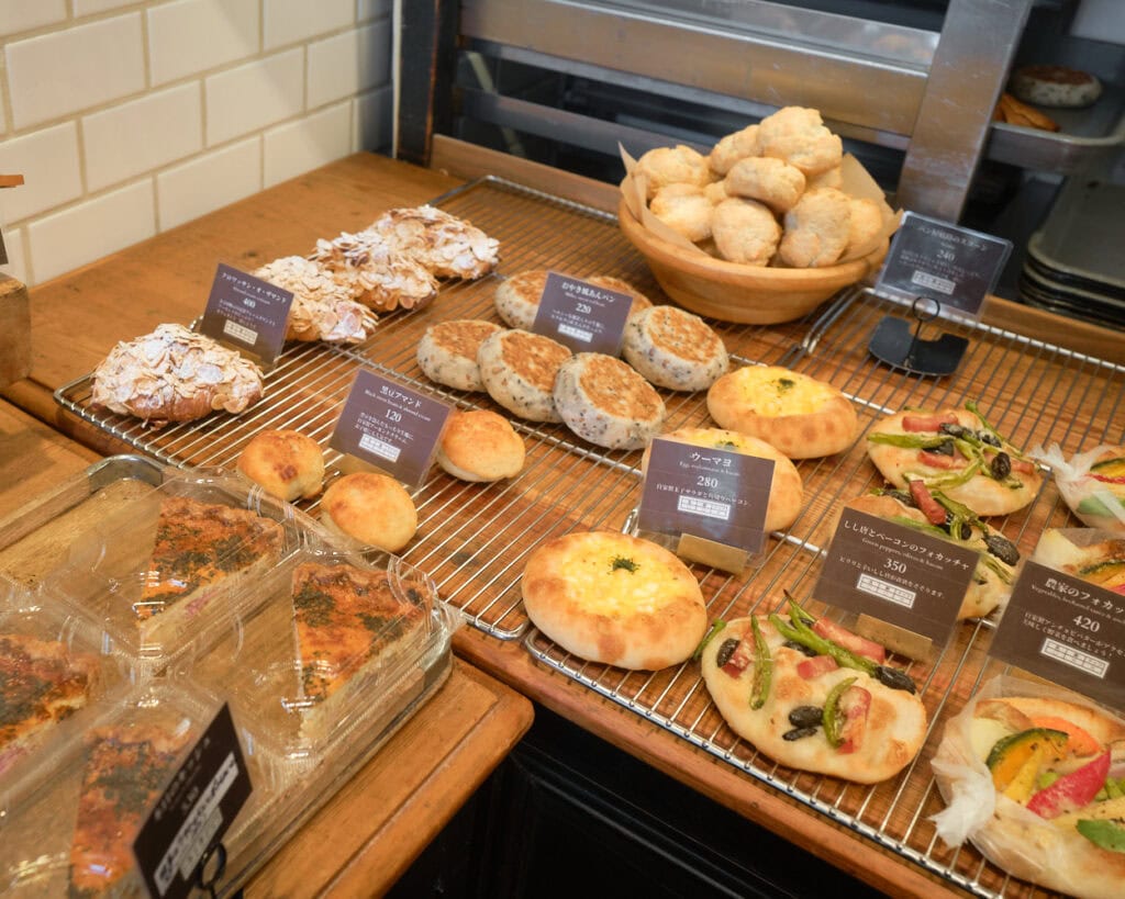 Koro Bakery's bread selection with sweet and savory breads, as well as quiche
