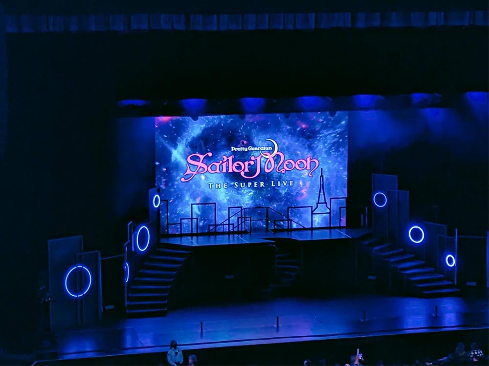 Pretty Guardian Sailor Moon The Super Live stage with three staircases leading to a projector platform