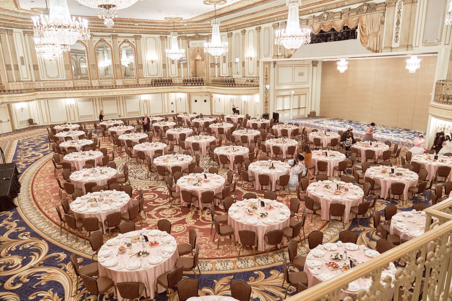 Venue room with empty tables before guests arrive.