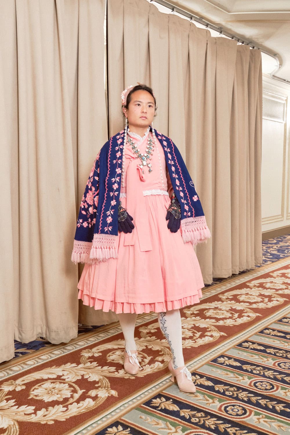Classic lolita wearing navy and pink pieces inspired by cultural themes.