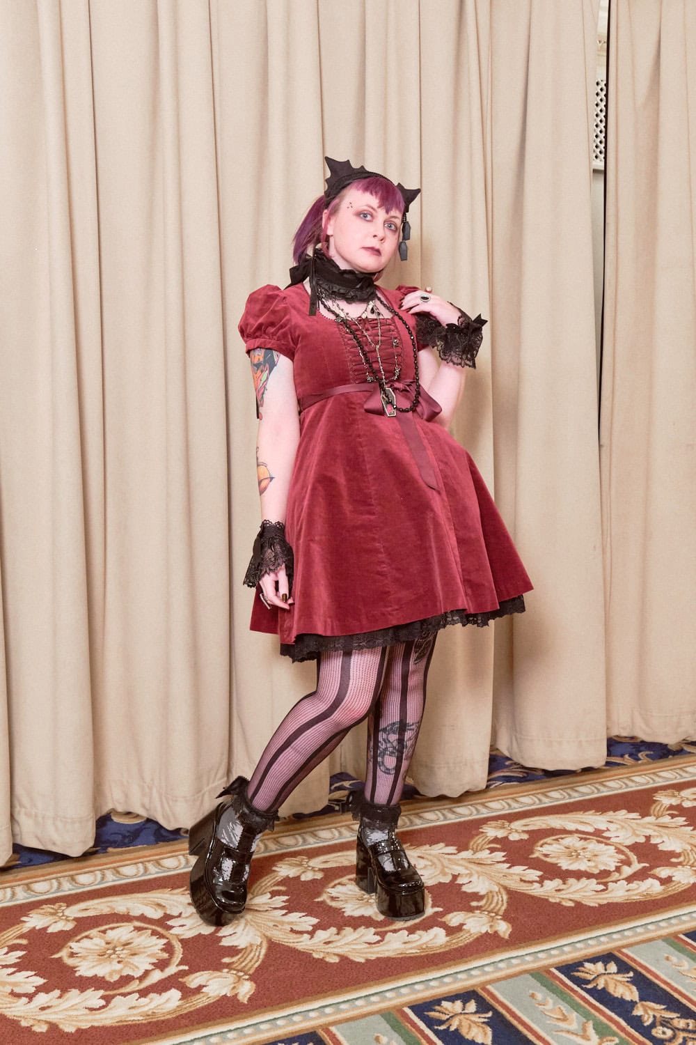 Gothic lolita wearing red velveteen short sleeve dress.
