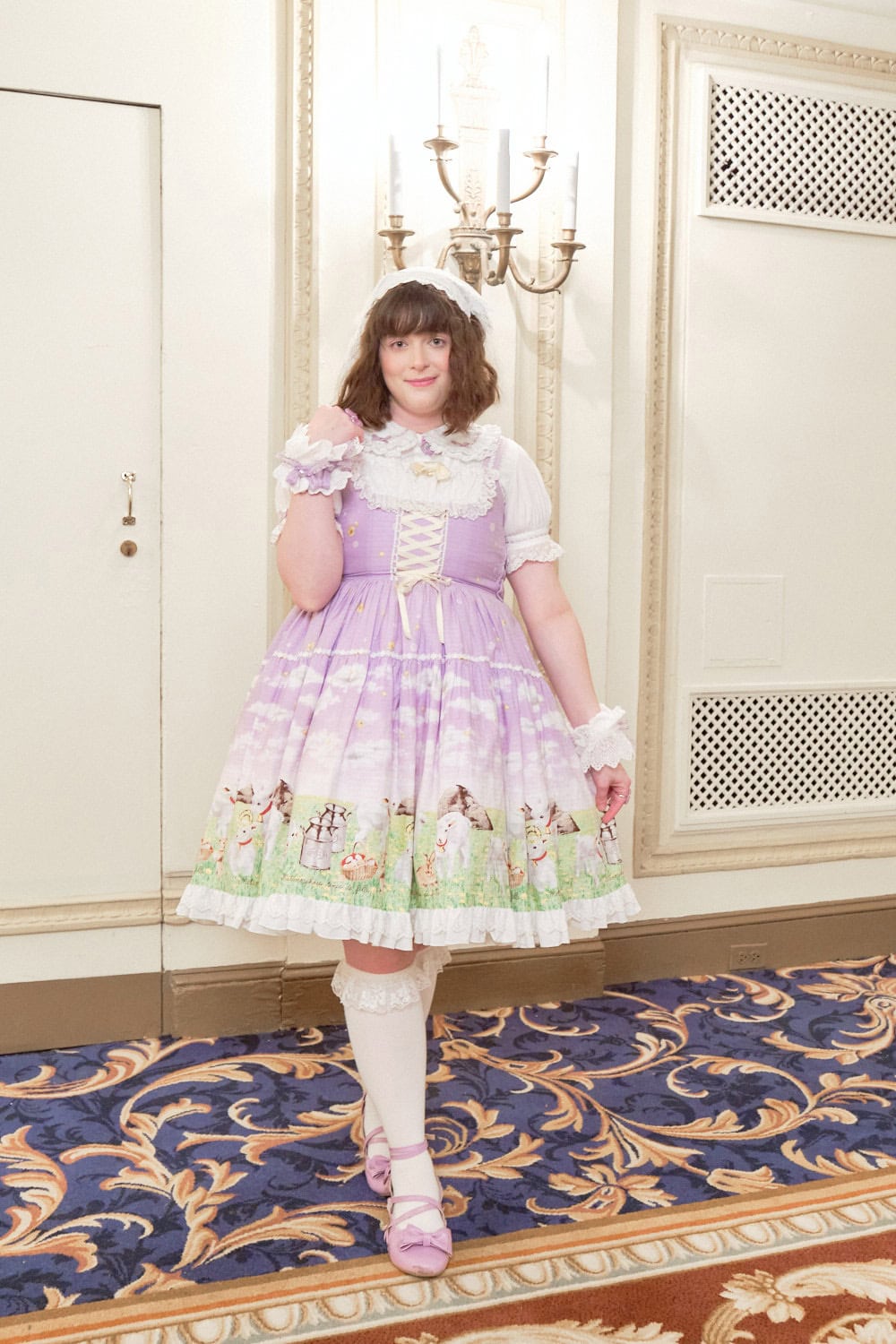 Sweet lolita wearing lavender print dress depicting animals in a field.