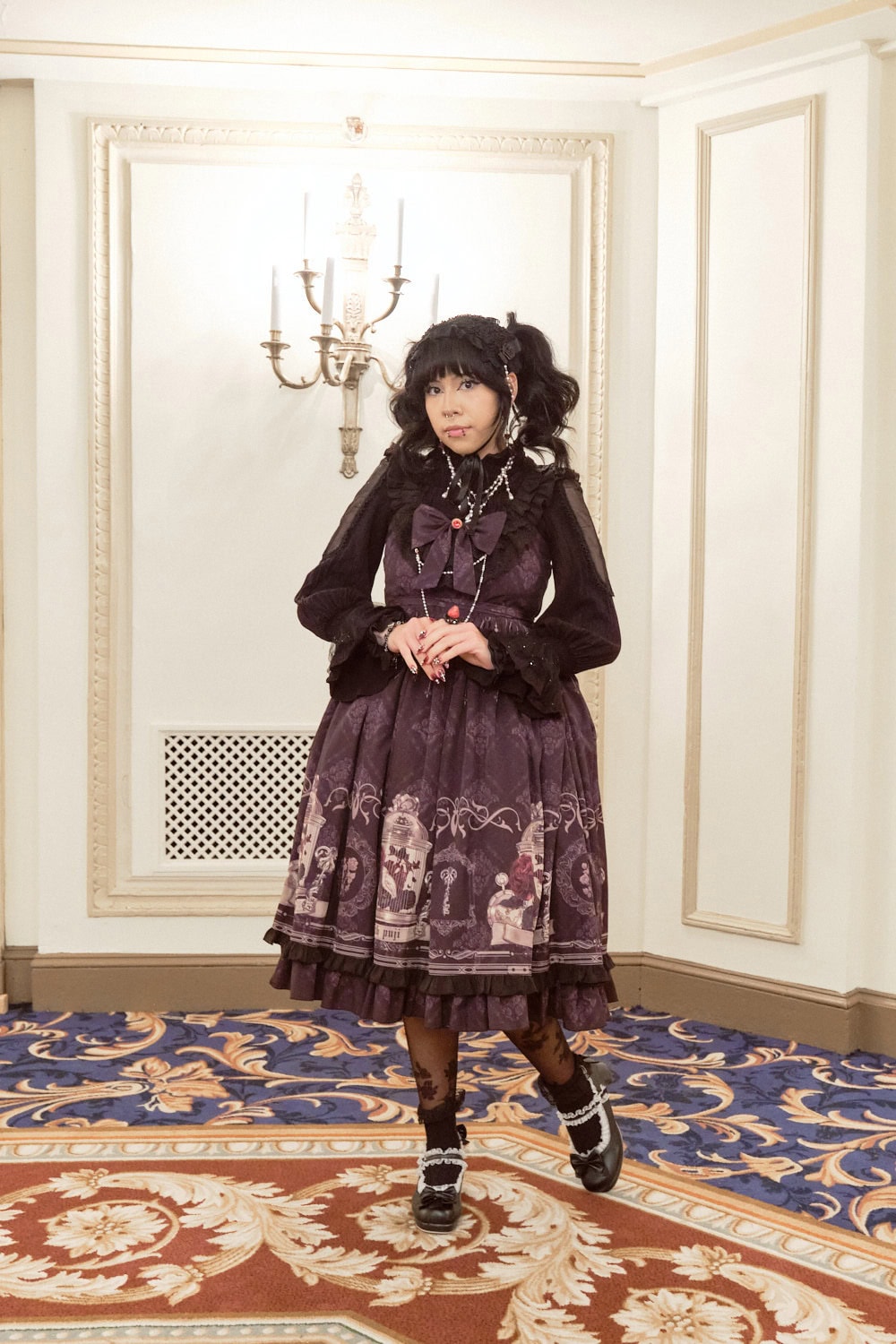 Gothic lolita wearing printed dress.