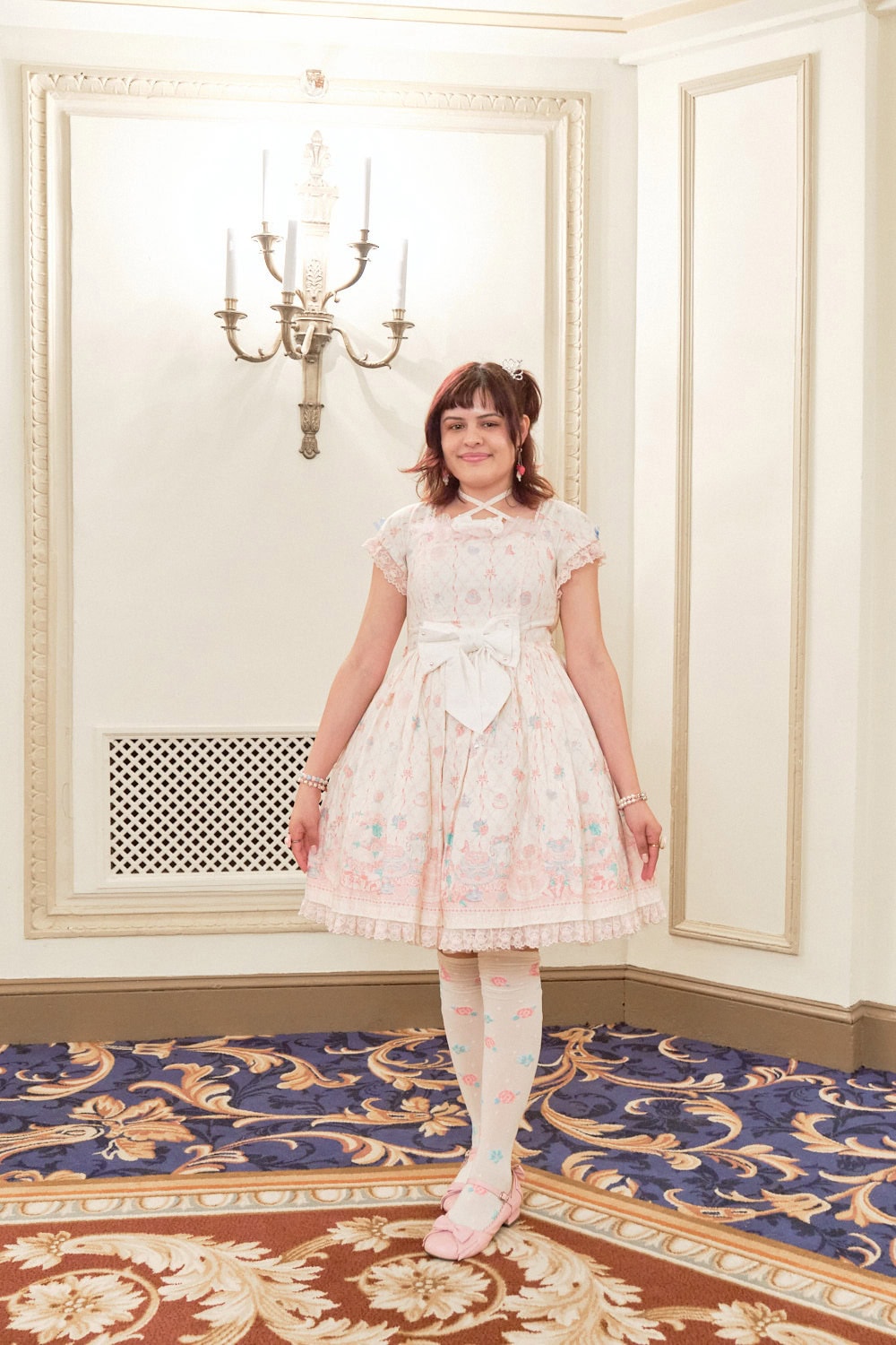 Sweet lolita wearing a cake themed dress by Angelic Pretty.