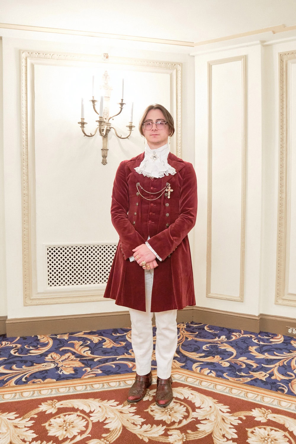 Ouji wearing a velveteen Roland Jacket, jabot, and white pants.