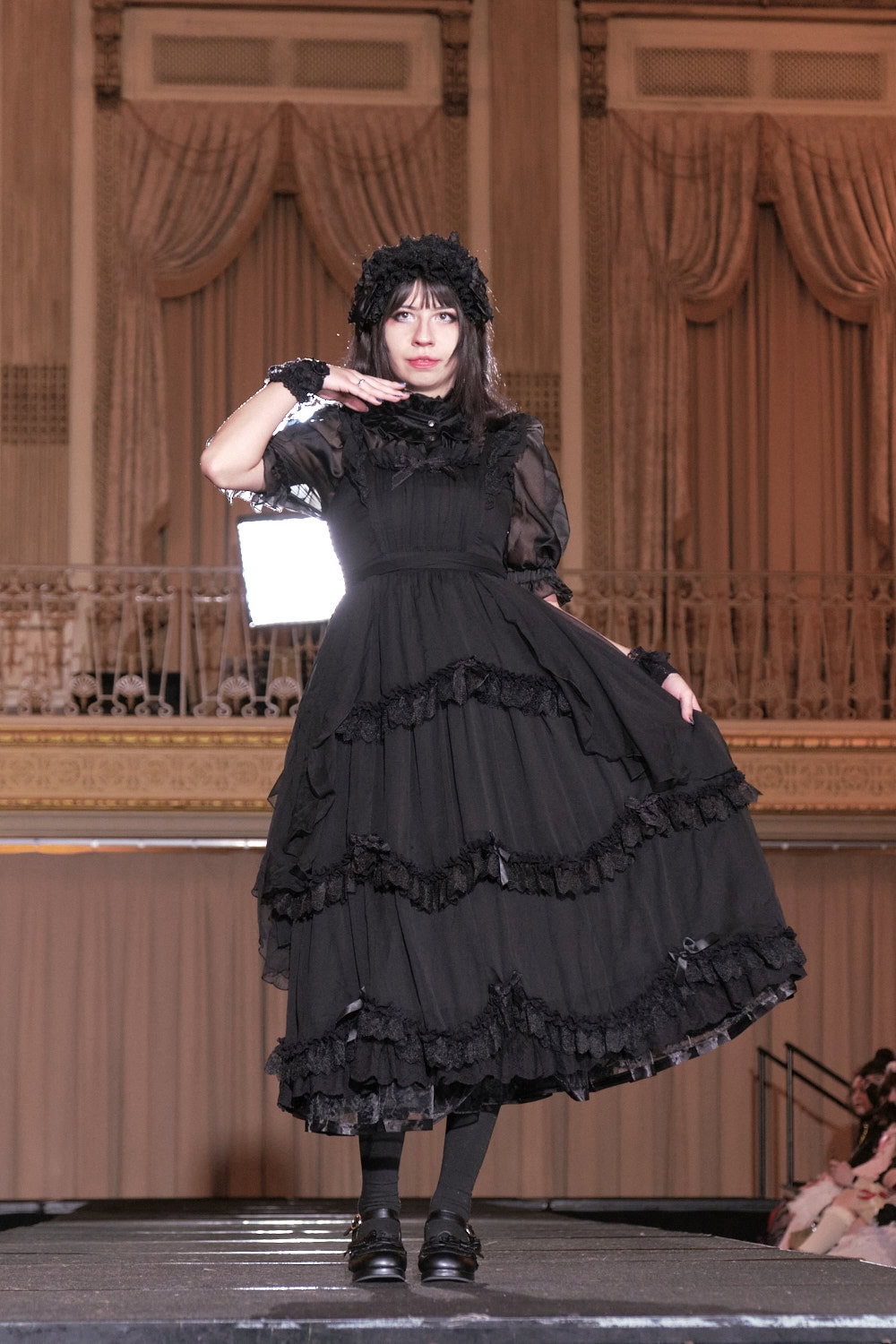 Model 4 wearing all black classic lolita by Hoshibako Works.
