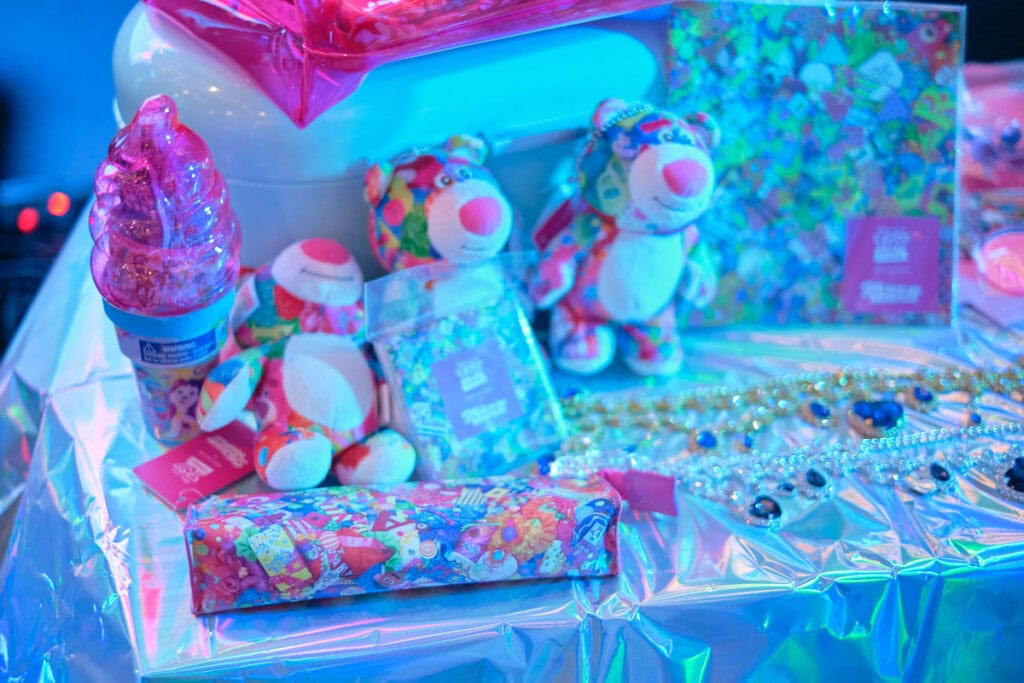 6%dokdoki plushies, and stationary as raffle prizes on table.