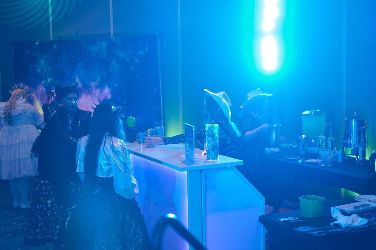 Bartenders taking orders from customers.