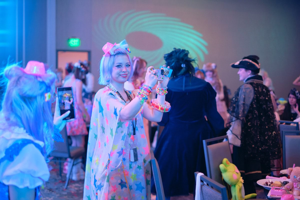 Model Haruka Kurebayashi taking a photo with cell phone.