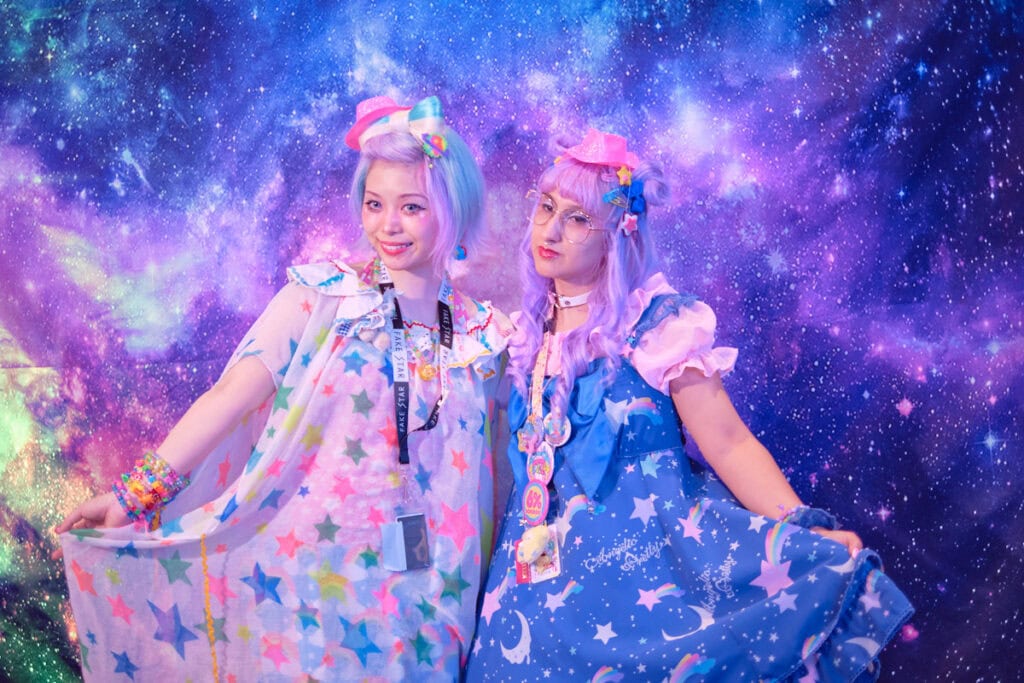 Haruka Kurebayashi and event organizer standing next to each other.
