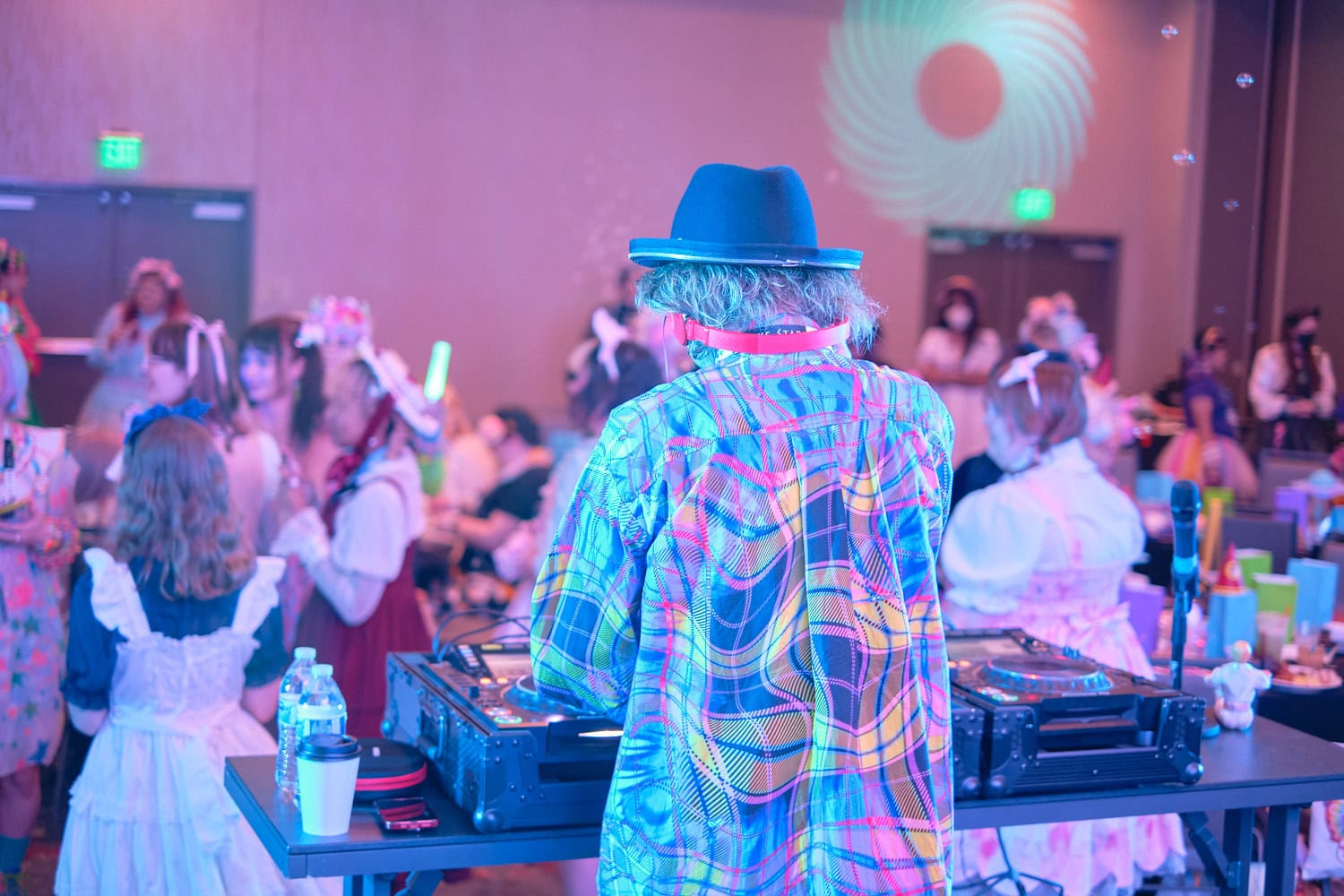 Sebastian Masuda putting on headphones while DJing.
