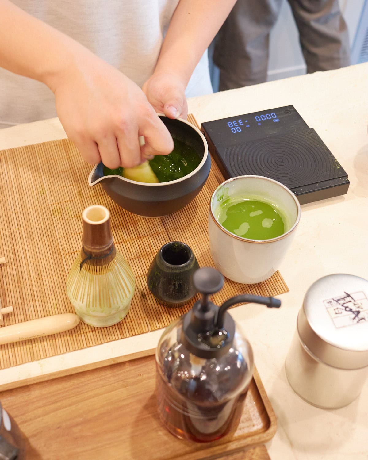 matcha being whisked at cocha