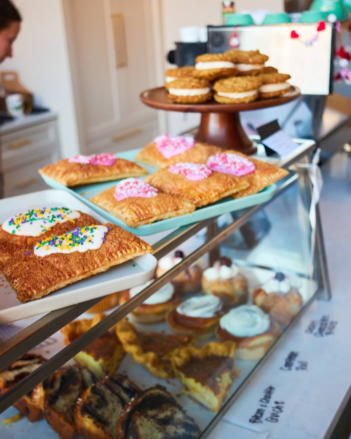 Bandit Patisserie display with mardi gras pop tart, strawberry pop tart, and oat meal cookie